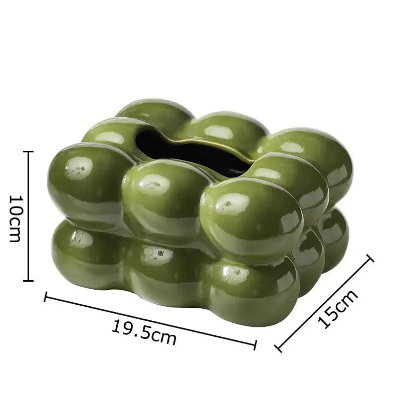 Glossy olive green ceramic ashtray with rounded bubble protrusions for dining table decor by decorbites cotton candy