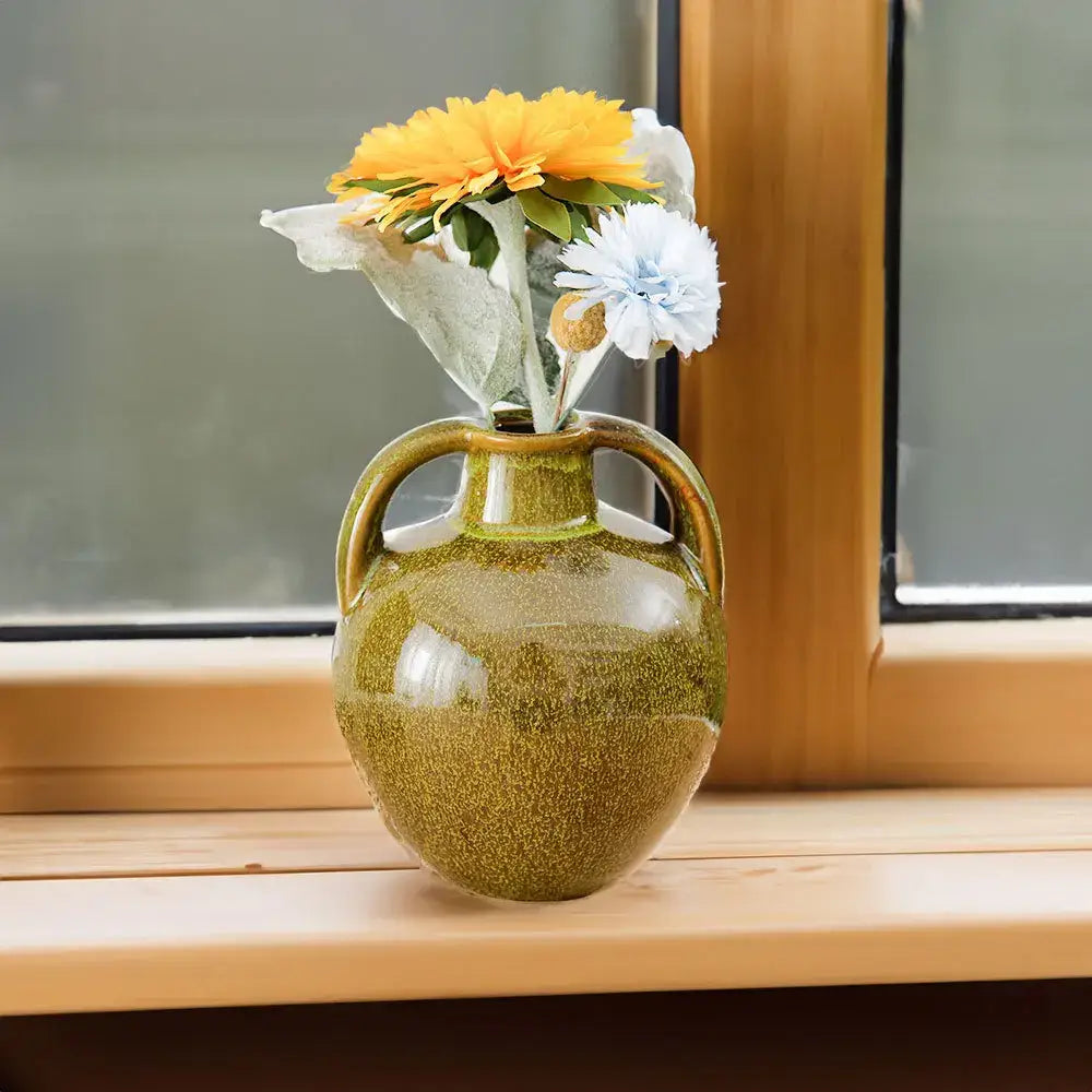 Glossy olive green speckled ceramic vases teapot flower kitchen decor with dual handles holding artificial yellow and white flowers
