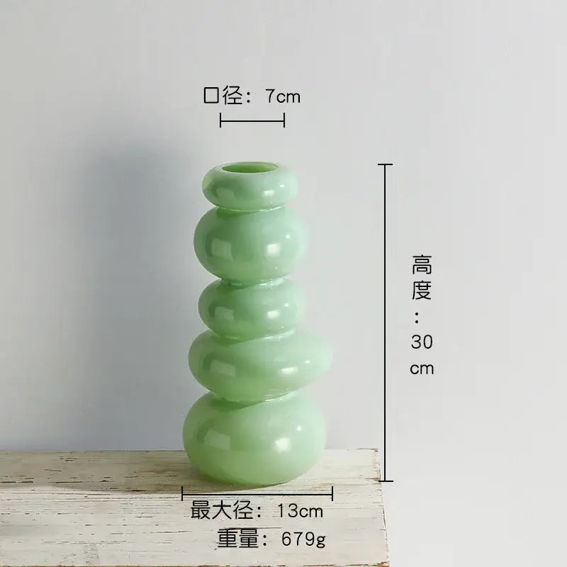 A sleek light green ceramic vase with modern pebble stack floral five rounded segments for living room decor