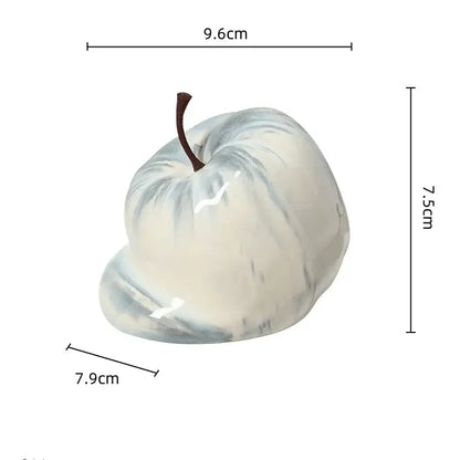 Glossy white and gray marbled ceramic melting apple figurine with brown stem for decorbites abstract melting apple decor