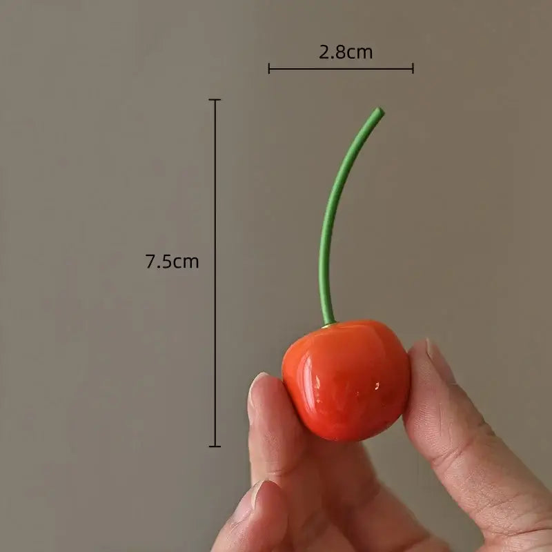 Glossy red ceramic cherry fruit sculpture tea caddy with green stem measuring 7.5cm by 2.8cm for kitchen decor