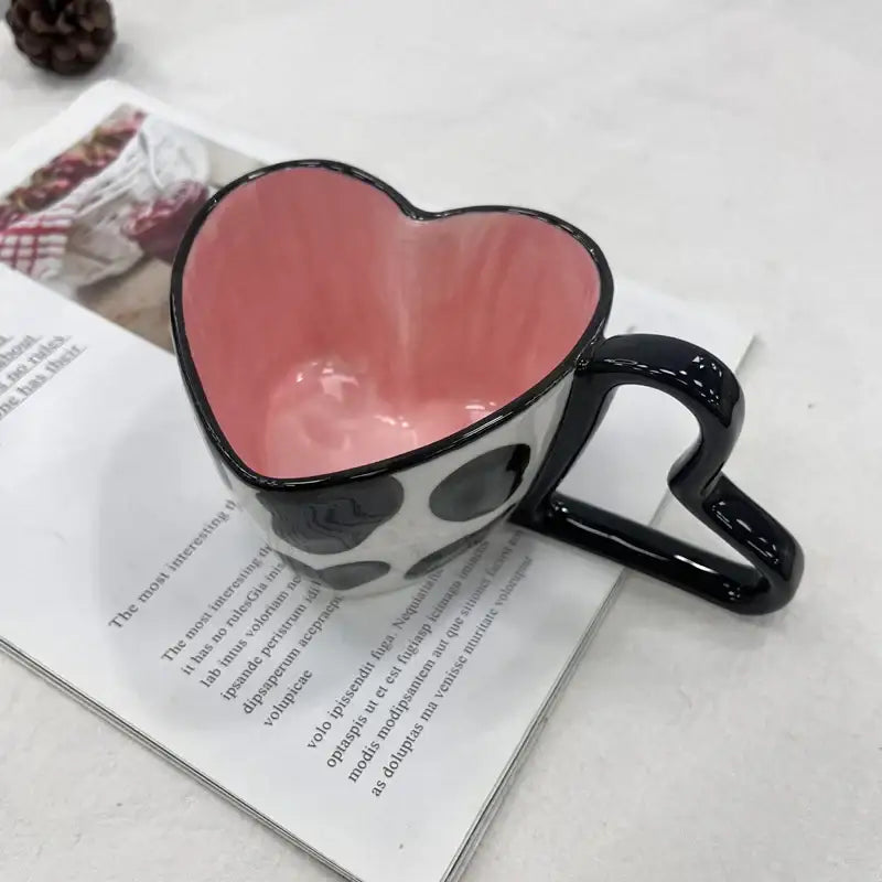 Glossy black heart shape ceramic coffee mug with pink interior and white exterior polka dots decorbites heart shape gift