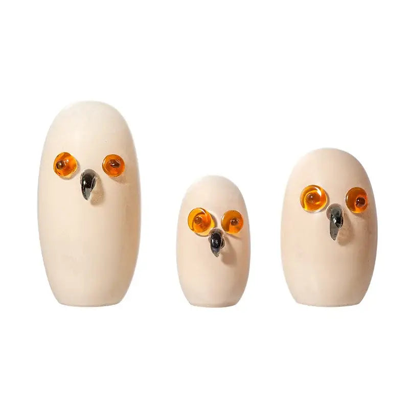 Three cream ceramic owl figurines with amber glass eyes and black metal beaks for glossy white cartoon owl glass home decor