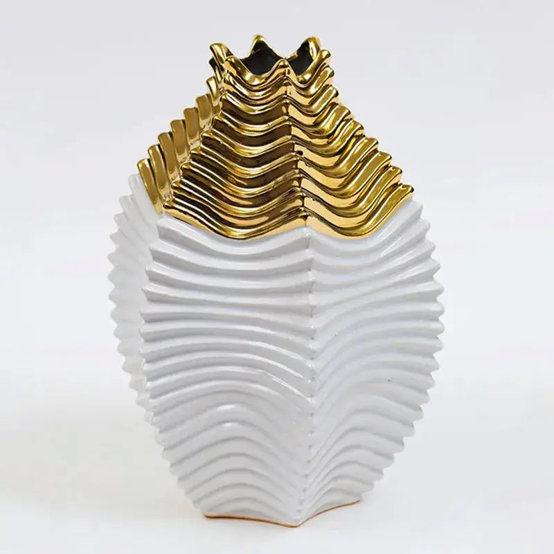 A sleek white ceramic vase with a glossy gold wave-patterned top perfect for decorbites fringe geometry decor