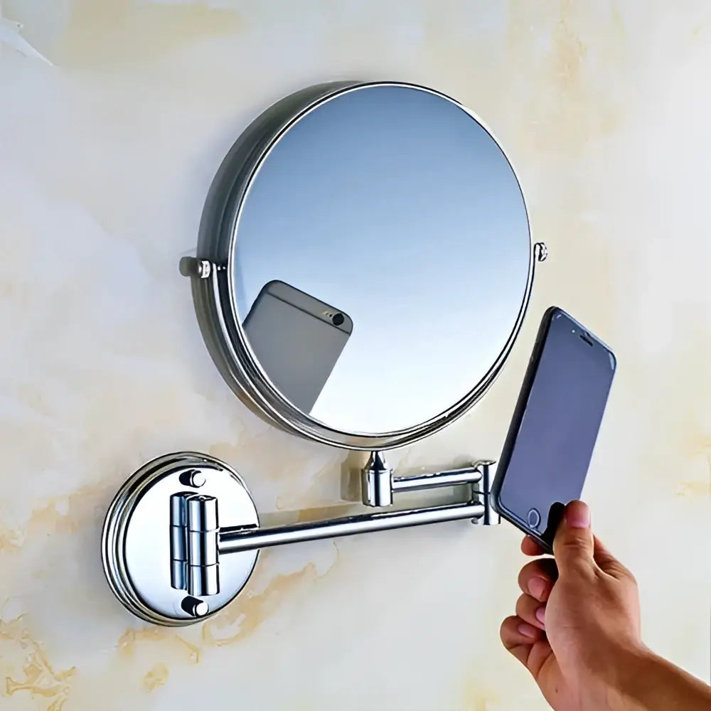 Chrome finished adjustable wall mounted cosmetic mirror with telescopic arm and dual sided reflective surface