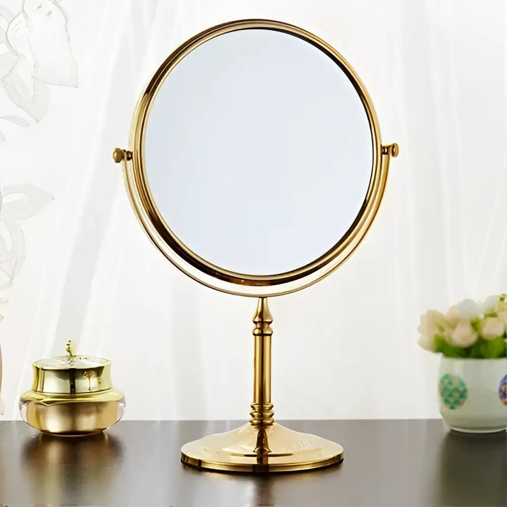 Gold finished double-sided vanity mirror with classic ornate stand and circular frame for decorbites adjustable wall mounted use