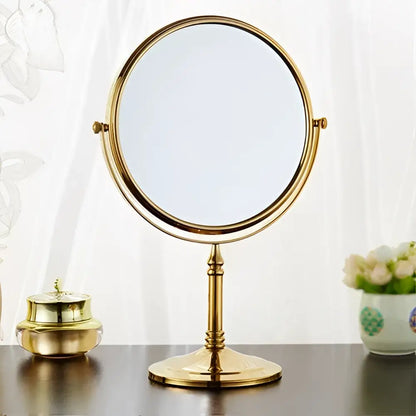 Gold finished double-sided vanity mirror with classic ornate stand and circular frame for decorbites adjustable wall mounted use