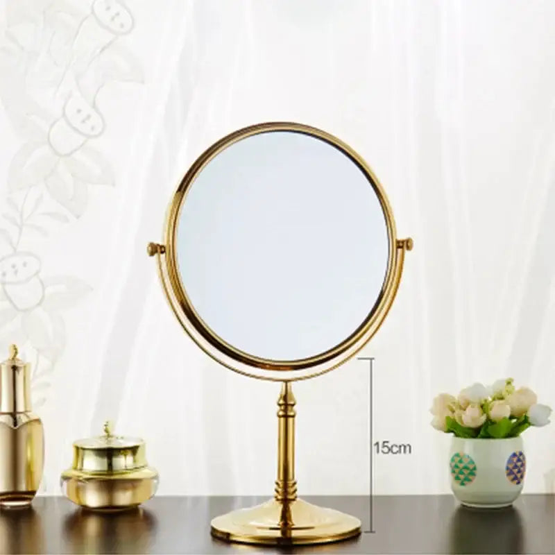 Gold and black adjustable wall mounted cosmetic mirror with gold-finished round dual-sided vanity mirror and slender stand