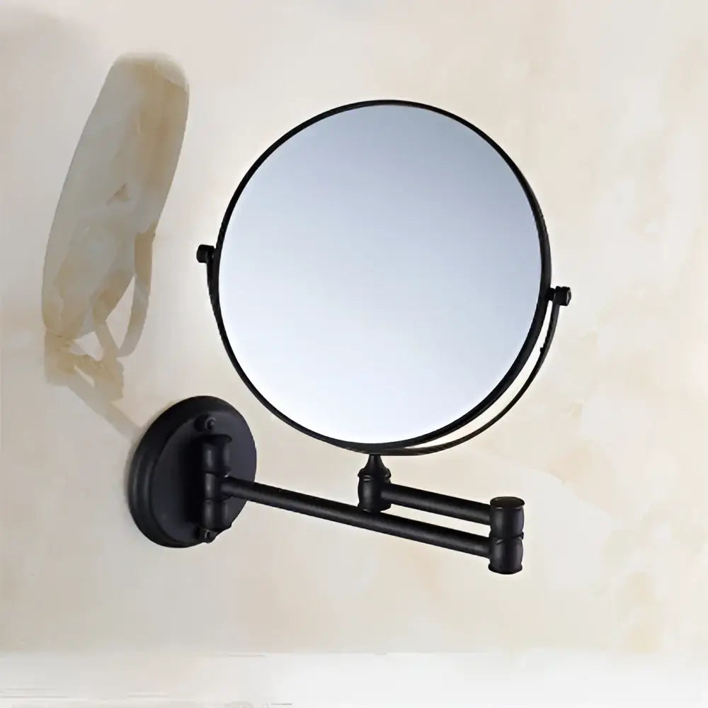 Black metal wall mounted cosmetic mirror with gold accents and adjustable arms by decorbites adjustable wall model