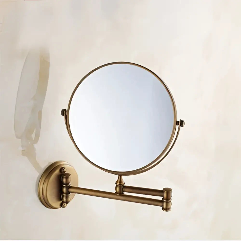 Brass-finished gold and black adjustable wall mounted cosmetic mirror with circular frame and extendable arm decorbites adjustable wall
