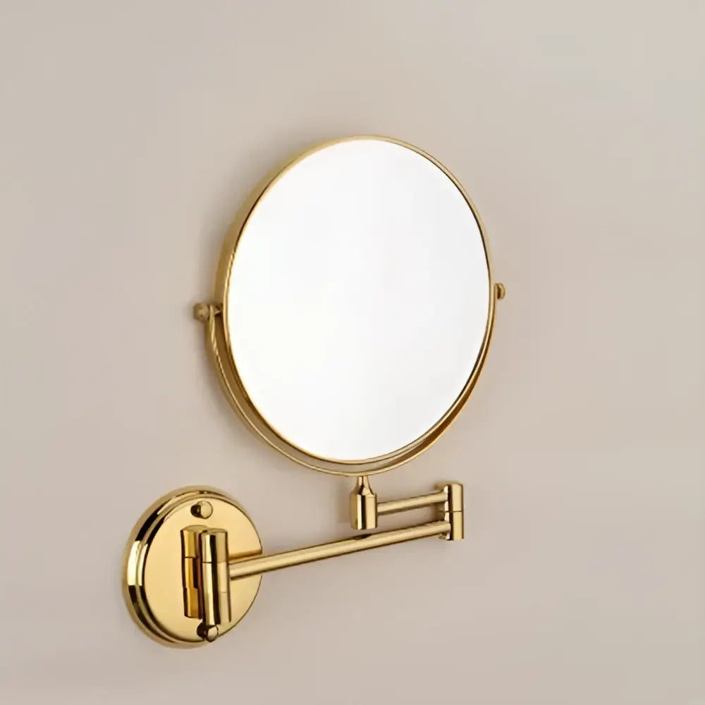 Gold and black adjustable wall mounted cosmetic mirror with gold-finished oval magnifying mirror and telescoping arm
