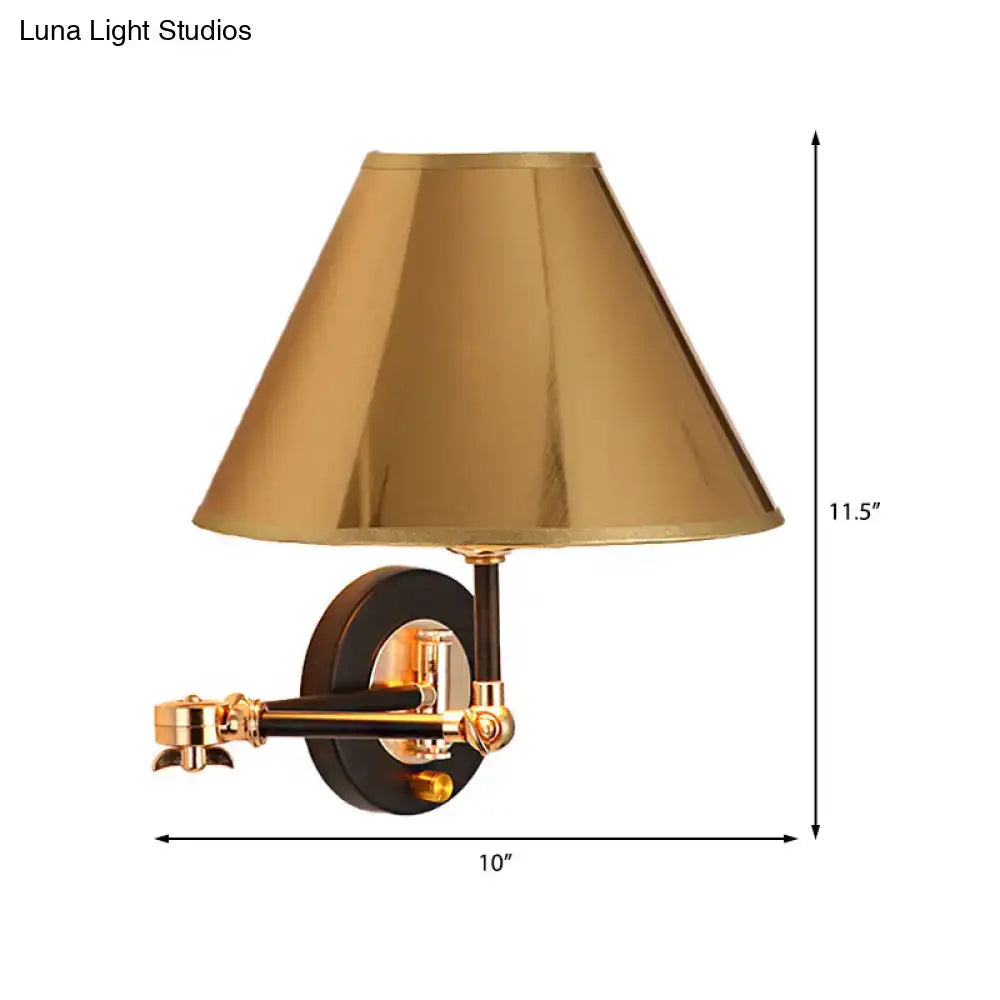 Gold-finished brass metal cone wall light with a black conical shade and adjustable swing arm for bedroom use