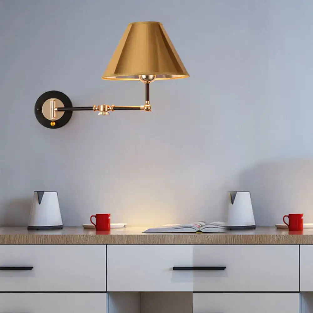 Gold and black metal cone wall light swing arm sconce with an adjustable conical shade and circular mounting plate
