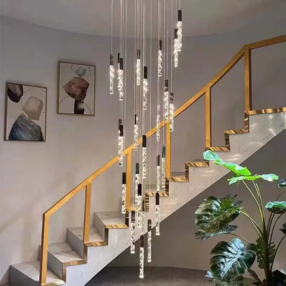 Modern gold and crystal led chandelier with sleek black and clear glass elements for staircase living room decorbites crystal led