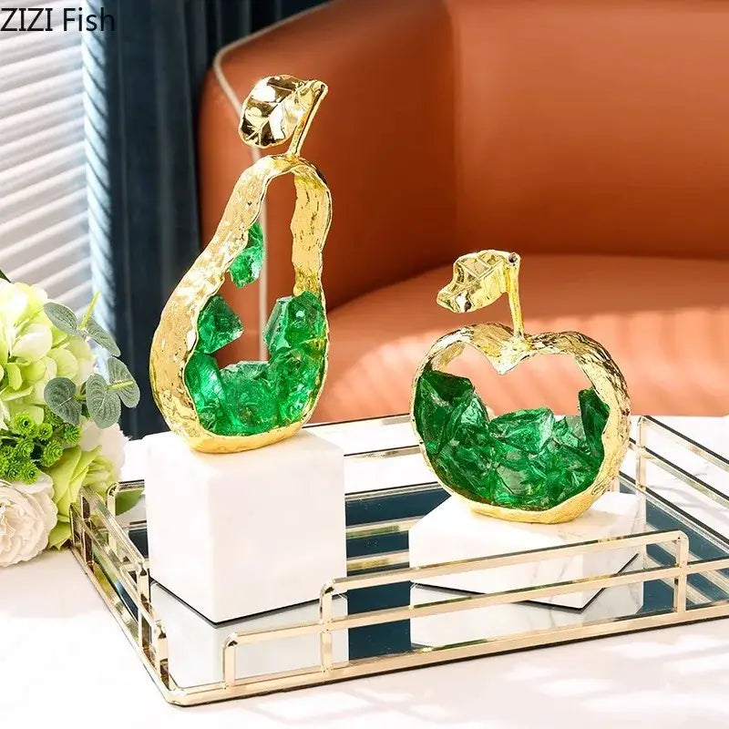 Gold and green crystal apple pear alloy ornaments featuring pear alloy ornaments with embedded green crystals on marble bases