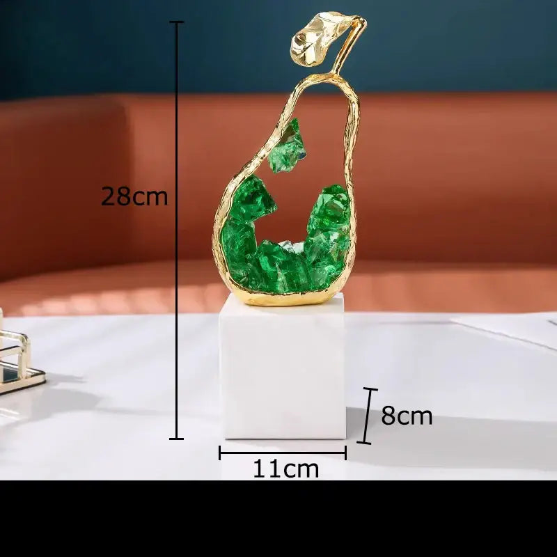 Gold and green crystal apple pear alloy decorative sculpture on white pedestal for living room decor