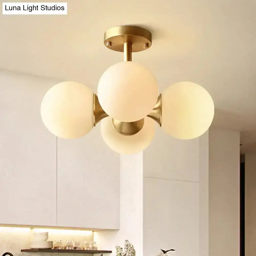 Modern brass-finished semi-flush mount ceiling light with four opaline glass globe shades for kitchen 220v-240v 110v-120v