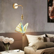 Gold and patterned butterfly led wall light featuring a gold-toned sconce with intricate yellow blue white lampshade