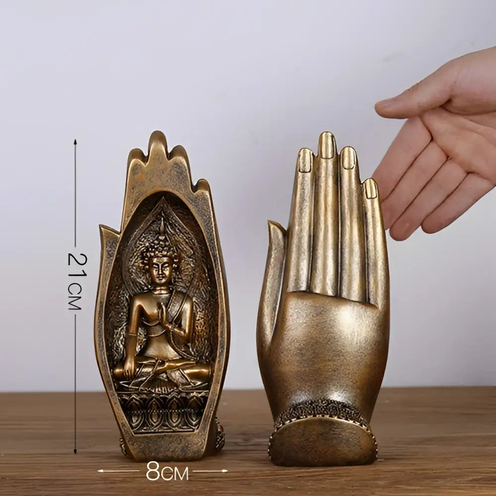 Gold and silver buddha hands monk figurine decor featuring a golden buddha statue nestled in hand-shaped bookend