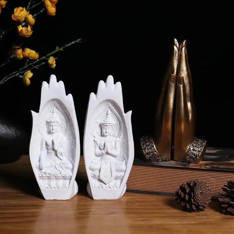White resin buddha hands bookends with detailed monk figurine carvings for living room decor by decorbites buddha hands