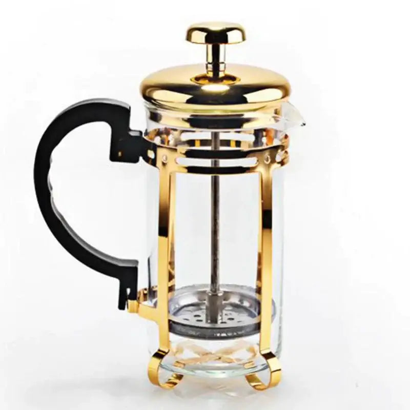 Gold-finished french press with black handle and clear glass body for use with decorbites drip kettle and drip kettle pot