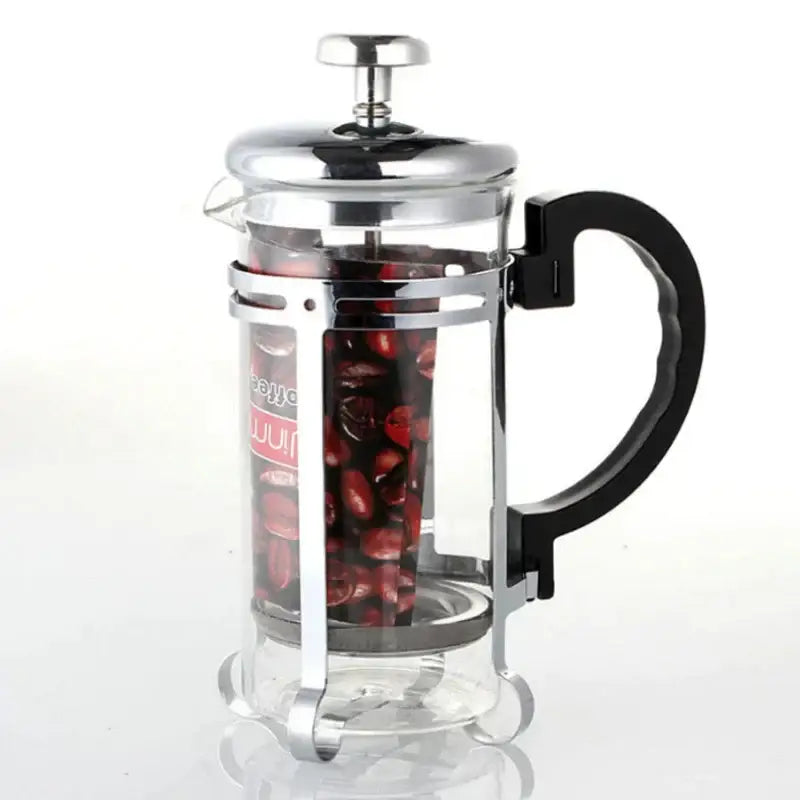 Gold and silver french press with black handle and silver metal components filled with dark roasted coffee beans for decorbites drip kettle use