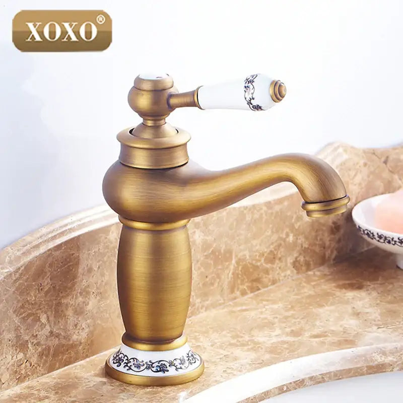 Antique brass finished gold and white ceramic deck mounted decorbites bathroom basin faucet with floral patterns