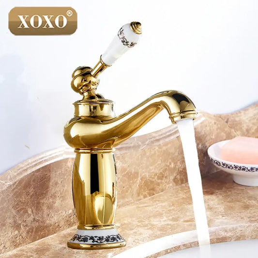 Gold and white ceramic bathroom basin faucet deck mounted mixer with gold finish and black ornate handle by Decorbites