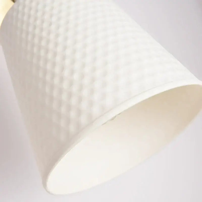 Gold and white ceramic led wall sconce with white textured lampshade and subtle quilted pattern for bedroom decorbites ceramic led wall