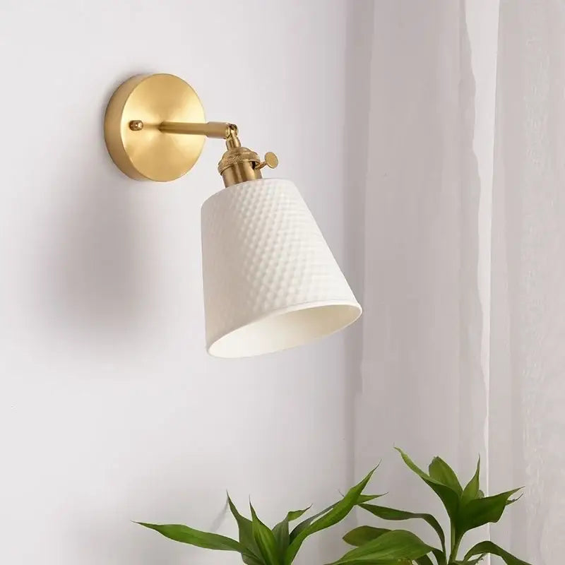 Gold and white ceramic led wall sconce with pull chain featuring a gold finish and textured ceramic shade for bedroom decorbites ceramic led