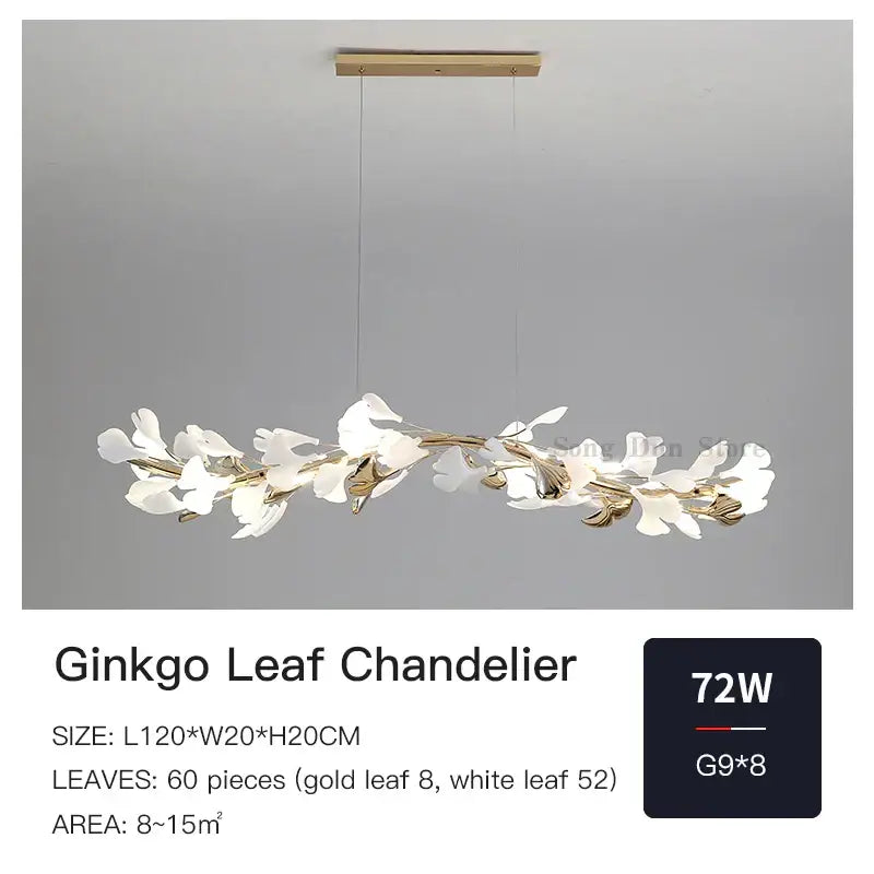 A decorbites ginkgo ceramic chandelier with white and gold leaf designs on a sleek brass fixture for dining rooms