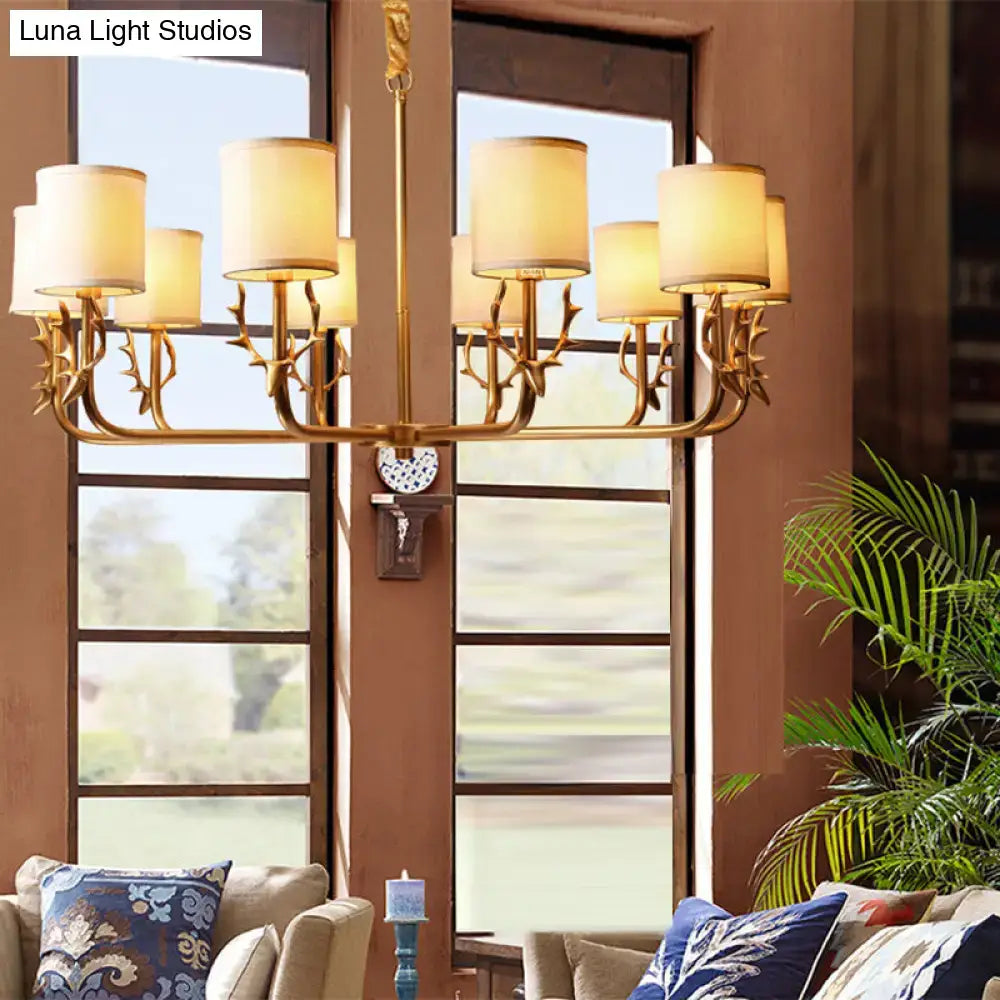 Gold-toned antler deco chandelier with fabric shade and cream-colored cylindrical shades for living room light compatible with led incandescent fluorescent bulbs