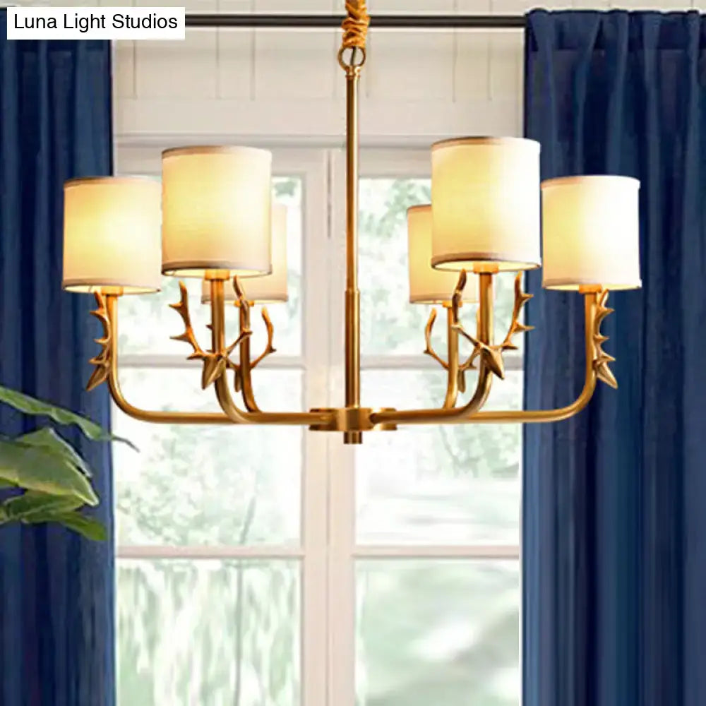Gold antler fabric shade cylindrical chandelier with gold-toned antler deco arms and cream fabric shades for living room light