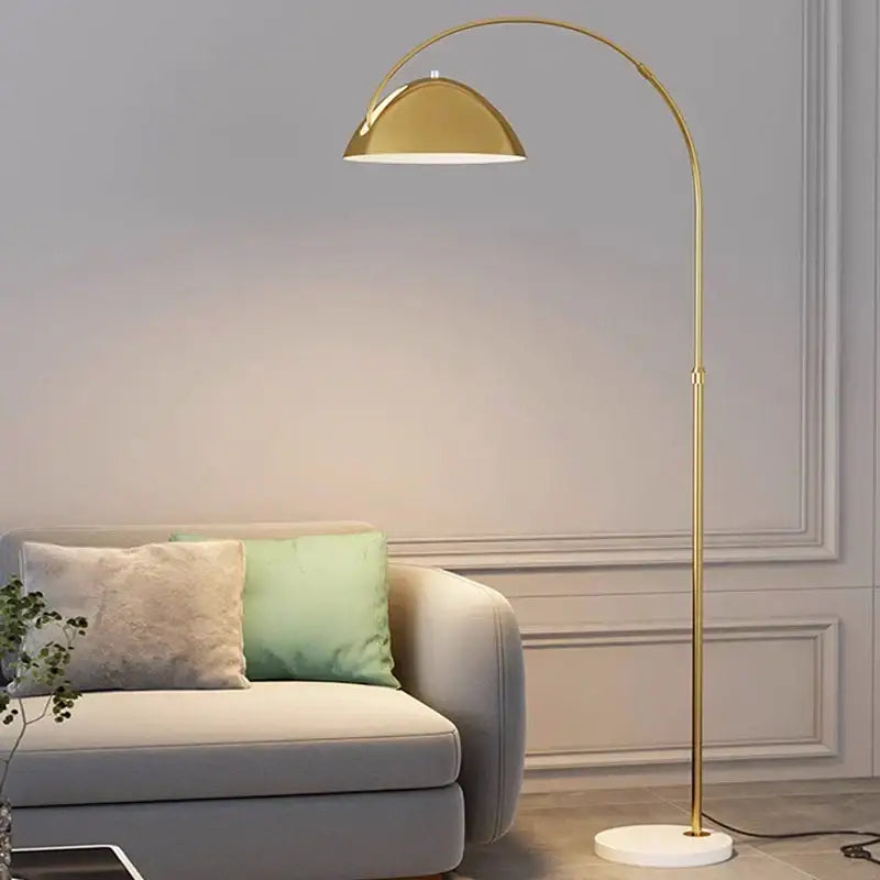 Gold arched designer marble floor lamp with a sleek curved gold finish and white circular base for living room decorbites lighting