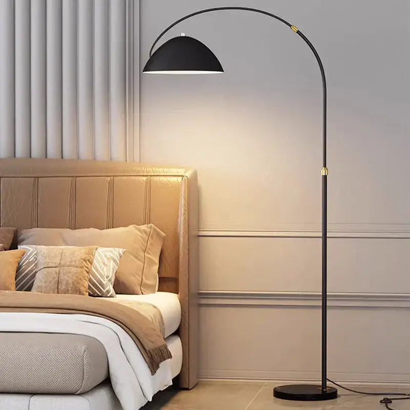 Black arched floor lamp with gold-toned accents and marble base from decorbites designer marble floor collection for living room lighting