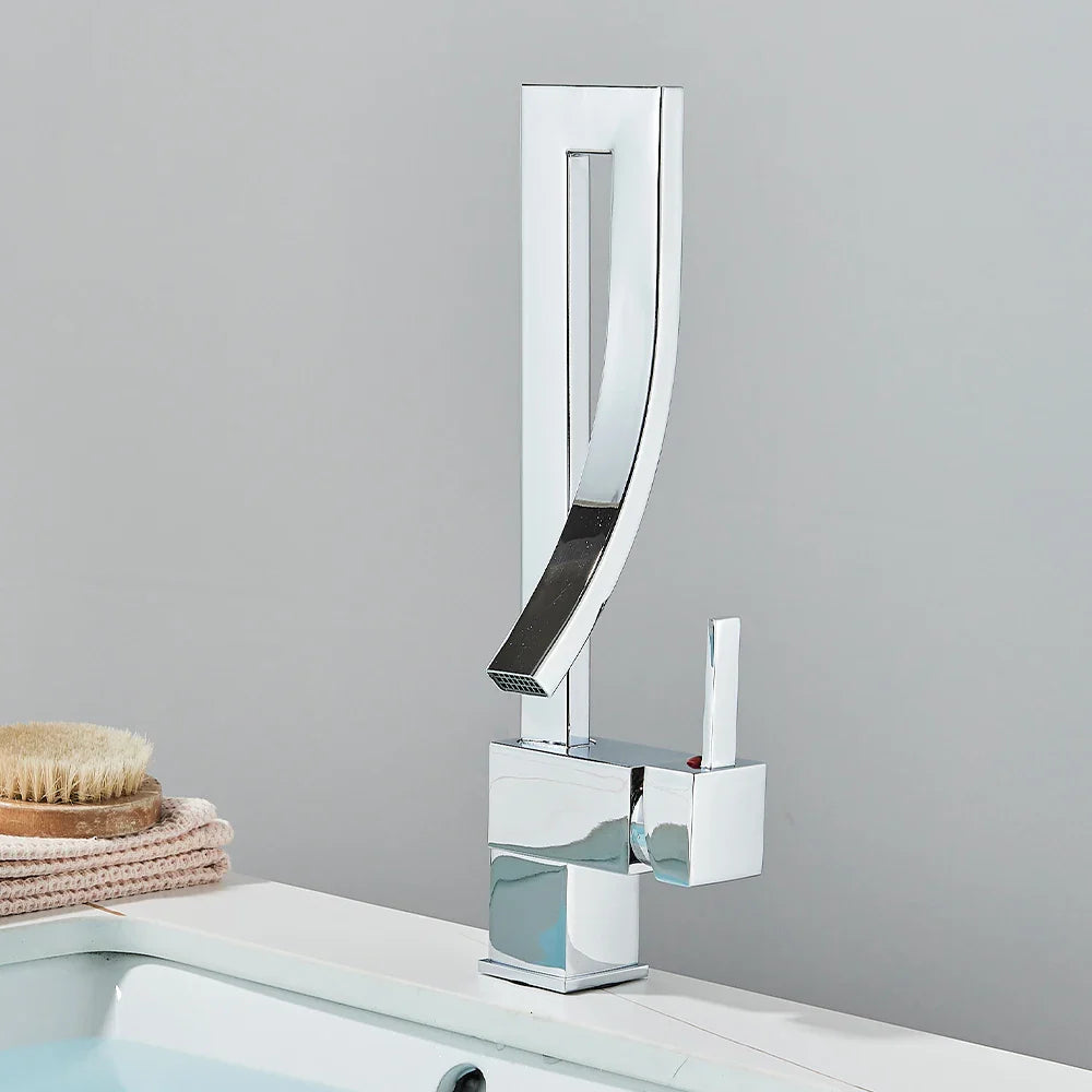 Modern chrome finished gold bathroom basin faucet with sleek curved spout and square base single hole deck mounted mixer tap