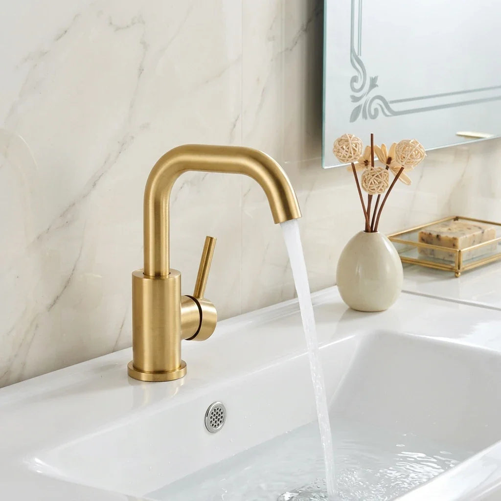 Gold bathroom faucet modern stainless steel with a sleek curved spout and cylindrical base in gold tone