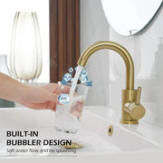 Gold bathroom faucet with a sleek curved spout and built-in bubbler in stainless steel finish