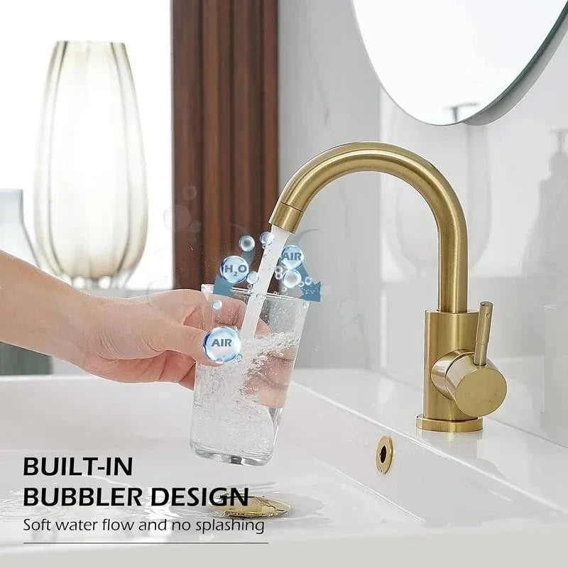 Gold bathroom faucet with a sleek curved spout and built-in bubbler in stainless steel finish
