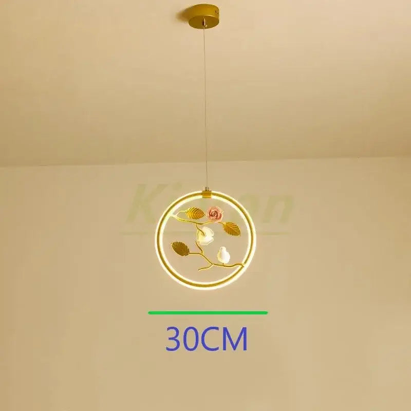 Gold bird led chandelier with glowing led ring featuring delicate floral and bird design for dining room decorbites bird led