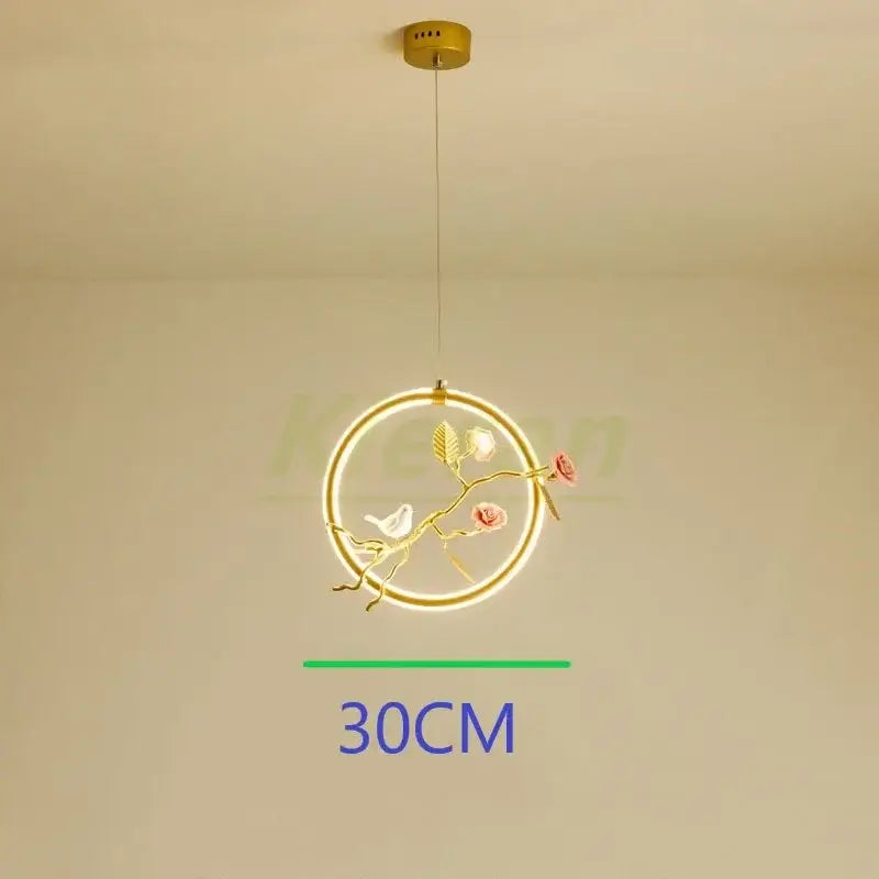 Gold-toned bird led chandelier with ornate branch design pink roses and white bird for dining room decorbites bird led
