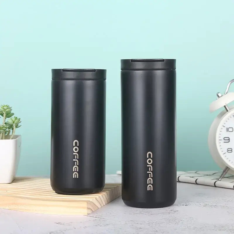 Two sleek black stainless steel decorbites insulated espresso travel mugs with silver coffee lettering for kitchen use