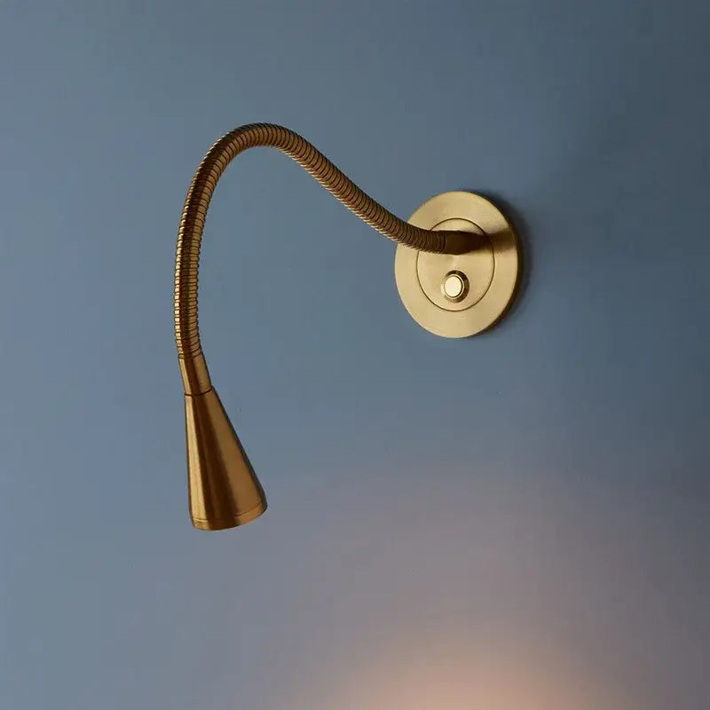 Gold-toned brass led gooseneck wall sconce with flexible ribbed aluminum led gooseneck and conical light head for reading