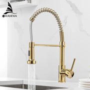 Gold brass spring spout kitchen faucet with pull down spray head featuring flexible coiled hose decorbites brass spring