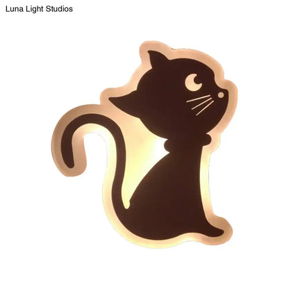 A sleek black cat-shaped led wall light with warm glow and white whiskers for children’s bedroom wall lights