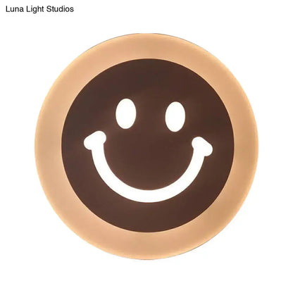 Gold and brown crescent led wall light with glowing white eyes for children’s bedroom wall light and sconce