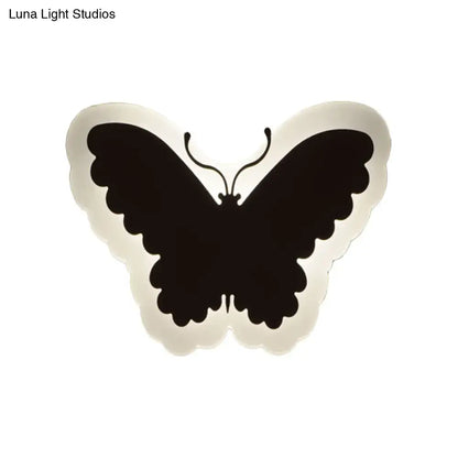 Black butterfly-shaped wall light with scalloped edge and minimalist design for children’s bedroom wall lights
