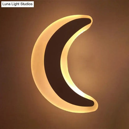 Gold and brown crescent led wall light with warm glow and sleek black design for children’s bedroom wall light