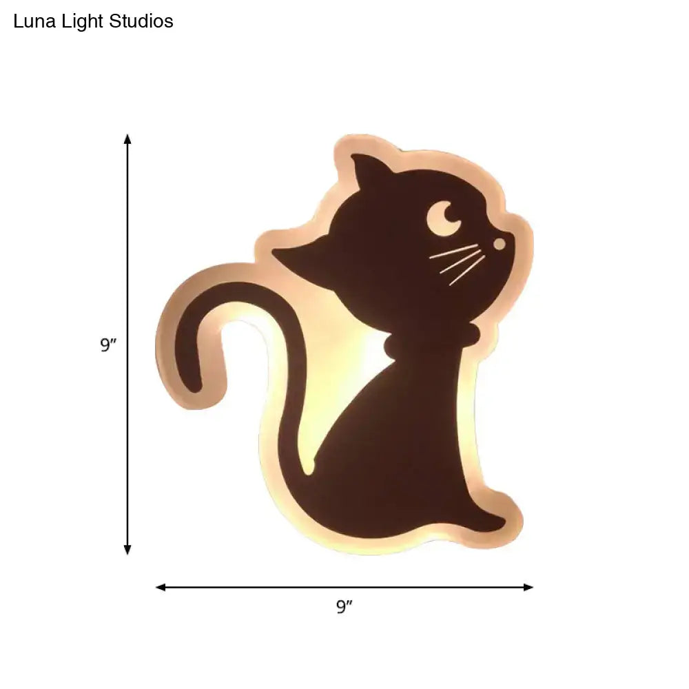 A sleek black cat-shaped led wall light with glowing amber outline for children’s bedroom wall lights