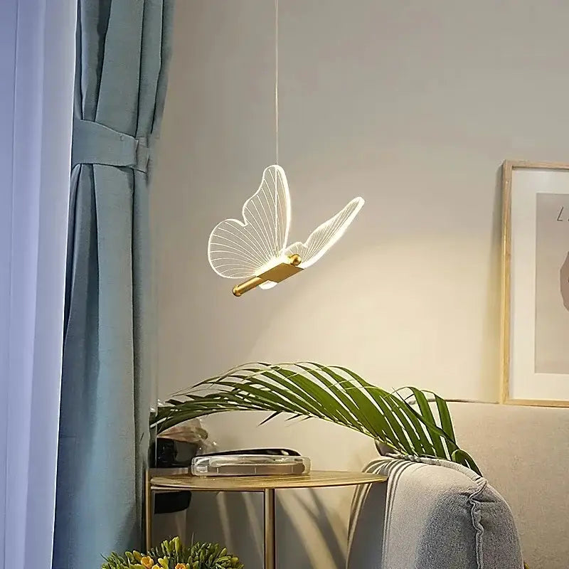 Gold butterfly acrylic chandelier pendant lamp with translucent wings and gold-toned body for bedroom lighting decorbites butterfly acrylic
